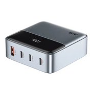 A gray Green Lion 100W GaN Premium UK Plug Adapter with multiple ports, including three Type-C and one USB-A, visible on the front panel.