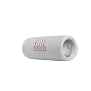 A white JBL Flip 6 portable IP67 waterproof speaker laying horizontally with the JBL logo displayed on the front.