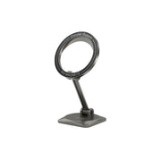 A black foldable MagSafe car holder made of zinc alloy and PC material, with a strong magnet for securing a smartphone, displayed on a stand.